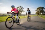 Montasen Kids Road Bike R05 - Teal : White Performance Youth Bike out for a road ride with father